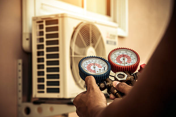 Professional Air Conditioning Service technician working in Heisson, WA